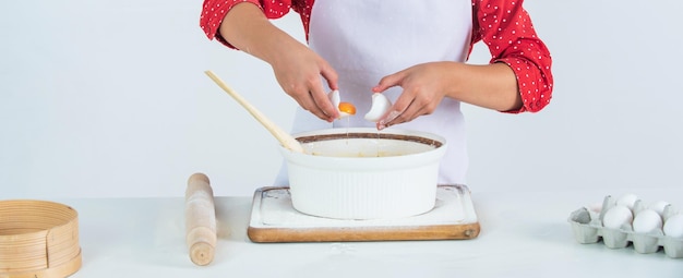 Cook stirring a pot in a cozy kitchen